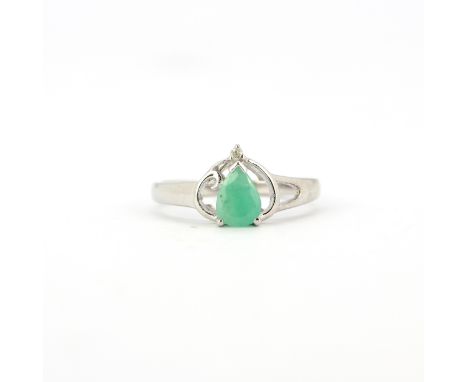A hallmarked 9ct white gold ring set with jade and a diamond, (N).
