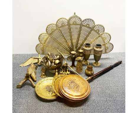 A brass peacock fan fire screen and other brassware.
