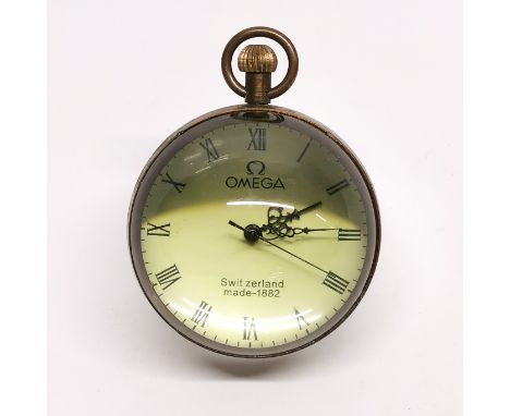 A reproduction Omega style crystal ball pocket watch clock, Dia. 6cm, appears to be in working order.