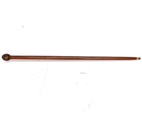 A bronze handled four faced walking stick.