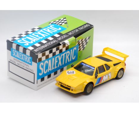 Scalextric Exin (Spain) - A boxed Scalextric Exin #4063 BMW M1. The model in yellow with RN31, marked 'Made in Spain' to base