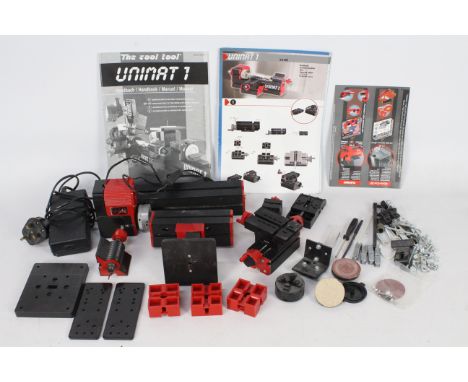 Unimat - An unboxed Unimat 1 model making lathe and accessories plus instruction book. It shows signs of use and appears phys