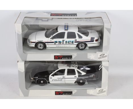 UT Models - Two boxed 1:18 scale UT Models UT0597 Chevrolet Caprice US police cars in Glendale PD and Asheville PD liveries. 