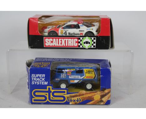 STS (Exin), Scalextric - Two boxed model slot cars, including STS (Exin) #2204 4x4 Pinzgauer 'Puch' in blue appears Good with