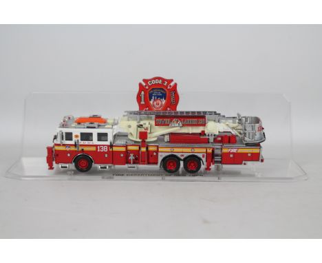 Code 3 Collectibles - A limited edition 1:64 scale Aerialscope Tower Ladder number 138 Corona Tigers in FDNY livery # 12735. 