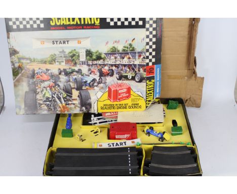 Scalextric - A boxed vintage 1966 Scalextric #70 Model Motor Racing Set. The set includes C72 BRM in blue RN9  - appears Fair