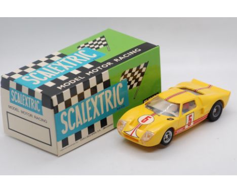 Scalextric Exin (Spain) - A boxed Scalextric Exin C35 Ford GT. The model in yellow with RN5 decals, marked 'Made in Spain' to