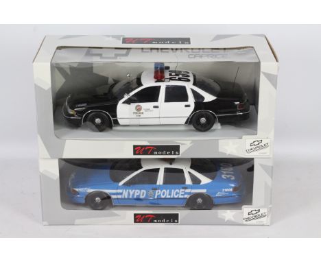 UT Models - Two boxed 1:18 scale UT Models UT0597 Chevrolet Caprice US police cars in Los Angles Police Dept. and NYPD liveri