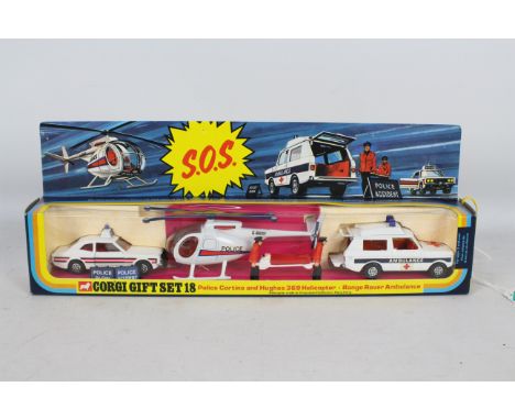 Corgi - A boxed Corgi GS18 'SOS' gift set. The set contains a Ford Cortina Police Car; Hughes 369 Police Helicopter; a Range 