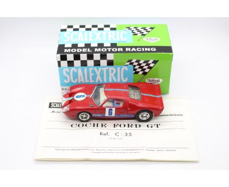 Scalextric (Exin) - An boxed Spanish made Scalextric C35 Ford GT. The model in red, has signs of play, with some wear to deca