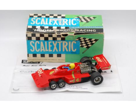 Scalextric Exin (Spain) - A boxed Scalextric Exin #4054 Tyrell F1 P-34. The model in red with RN4, marked 'Made in Spain' to 