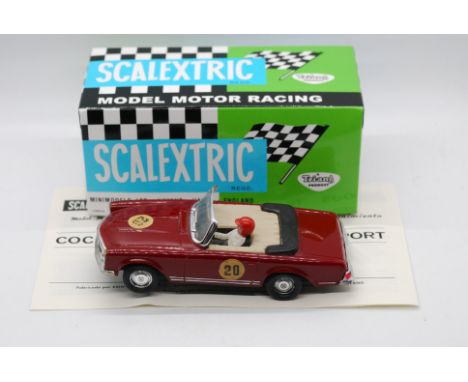 Scalextric (Exin) - An boxed Spanish made Scalextric C33 Mercedes 250 SL. The model in maroon, has signs of play, with slight