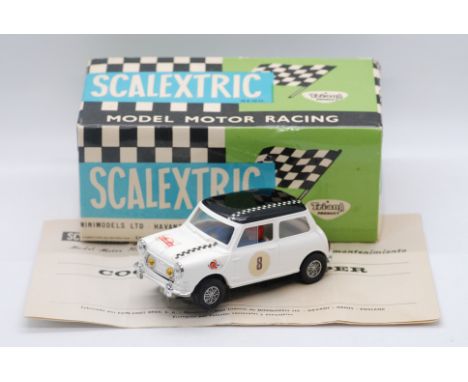 Scalextric Exin (Spain) - A boxed Scalextric Exin C-45 Mini Cooper. The model in white with black roof with RN8 decals to doo