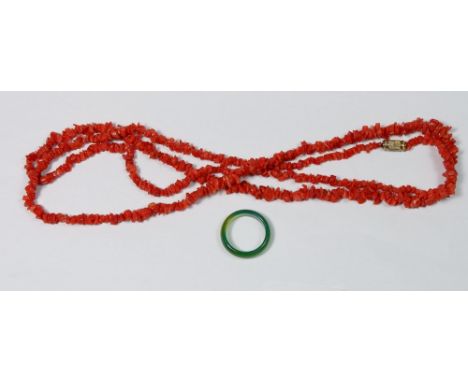 A jade ring and a coral necklace 