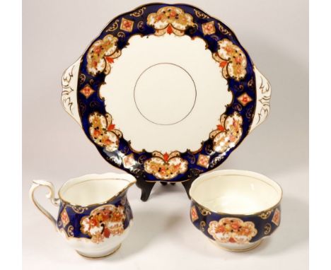 A Royal Albert 'Heirloom' tea service comprising: six cups and saucers, jug and sugar, six tea plates and cake plate 