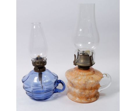 A Victorian mottled orange glass finger lamp and a blue glass one
