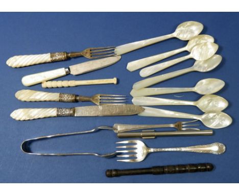 A group of silver and mother of pearl cutlery including seven mother of pearl spoons 