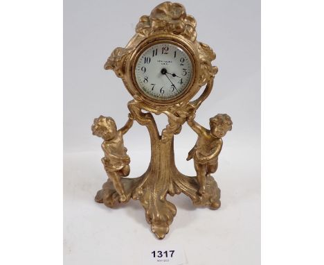 A New Haven USA gilt cast cherub wall clock, 21cm high 