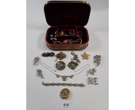 A jewellery box containing various marcasite brooches, Celtic stone brooches etc 