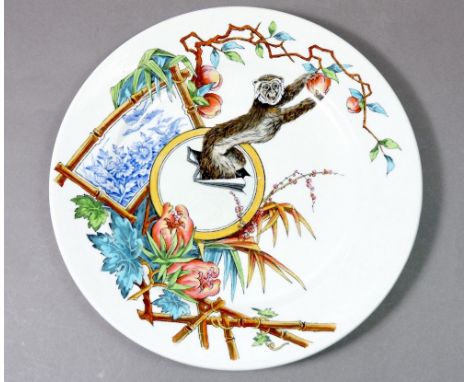 A Royal Worcester Victorian Aesthetic style plate printed and painted monkey picking fruit, 23.5cm diameter 