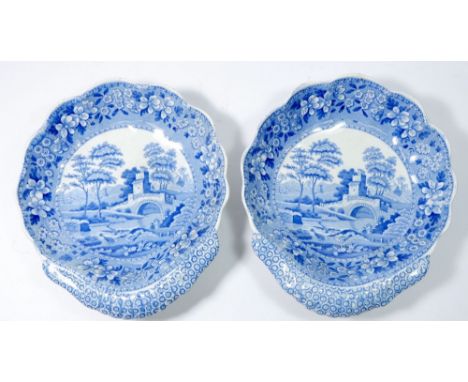 A pair of Spode shell form serving dishes printed pastoral landscapes - one repaired 