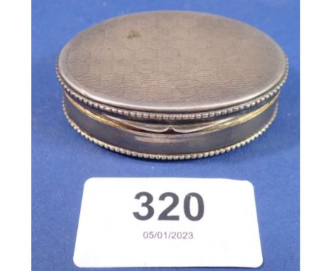 An oval 900 standard silver engraved snuff box, 28g 