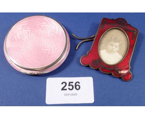 An enamel miniature photograph frame, 5.5 x 4.5cm and a silver and enamel compact, a/f 