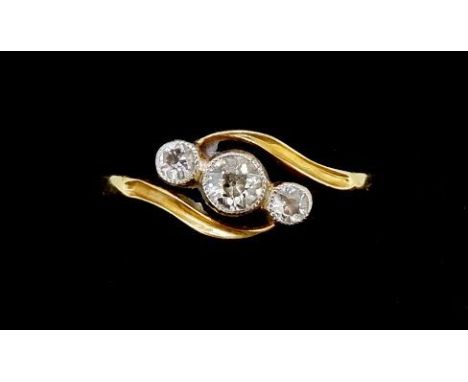 An 18 carat gold three stone crossover ring with 9 carat gold size insert, size N to M approx 