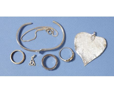 A silver bangle, silver bracelet and pendant plus three other rings etc. 