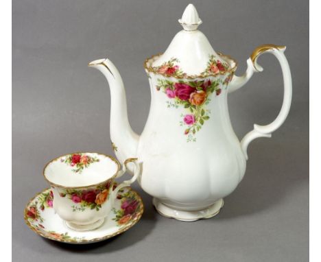 A Royal Albert Country Roses tea service comprising: six cups &amp; saucers, six tea plates, coffee pot, teapot, milk, sugar,