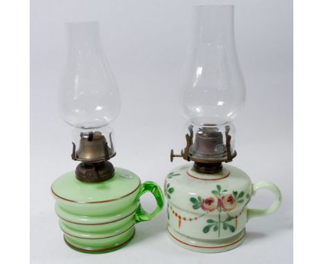 A Victorian green opaque glass finger lamp and a floral painted one 