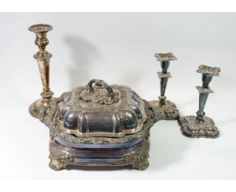 A 19th century Sheffield plated square entree dish on stand, a pair of similar candlesticks and one other candlestick 
