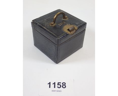 A leather clad travelling inkwell 