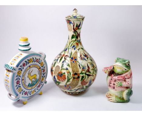 An Isnik pottery vase and cover, a/f 32cm, a frog tobacco jar a/f and a faience flask