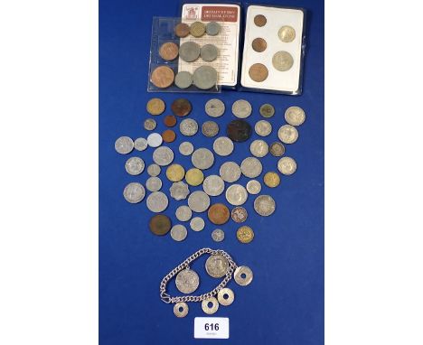 A miscellaneous lot of world coinage including: British 1953 set some silver threepence, Britains first decimal coin set and 