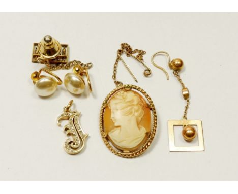 A gold letter form pendant with inset chip diamonds marked 14 carat 585 with a gold abacus pin marked 14 carat, a pair of 9 c