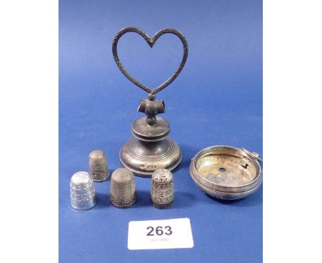 A silver heart form dressing table item a/f, a silver watch case, two silver thimbles and two other thimbles