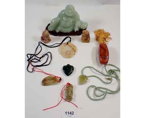 A 'jade' Buddah on stand and various oriental agate stone necklaces etc