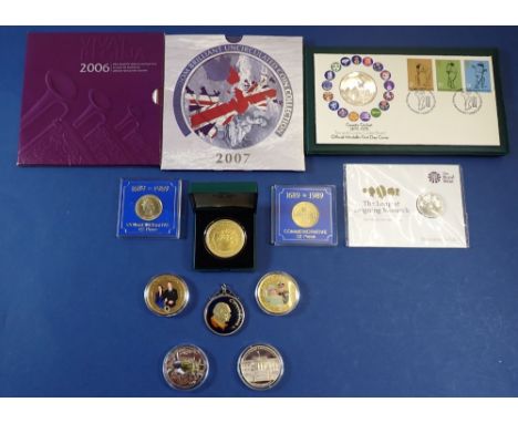 A quantity of coins, commemoratives and medallions including: Royal Mint issues - 2006 Elizabeth II eighteenth birthday crown