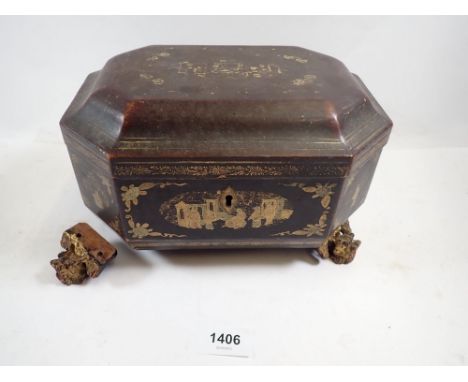 A Chinese lacquer tea caddy fitted two pewter caddies, all on lions head feet, 23cm wide
