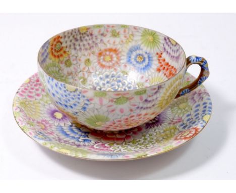 A Japanese eggshell tea service comprising: eleven cups and saucers in 'mille fleur' pattern