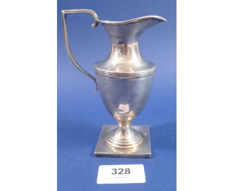 A silver helmet form cream jug, Chester 1912, marks worn, 113g 