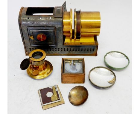 A Victorian magic lantern with lens and small quantity of slides 