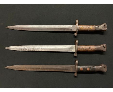 A collection of three Lee Metford bayonets: two maker marked "Wilkinson Sword, London" and dated  "7-96" and "4-02" both with