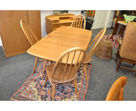 A set of four Ercol Quaker dining chairs; an Ercol drop leaf dining table