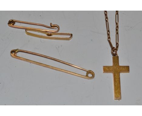 A 9ct gold bar brooch;  a 9ct gold cross and chain, 7g;  a 15ct gold bar brooch, 2.7g;  