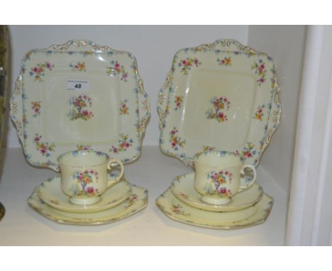 A Paragon tea service for two, red and yellow flowers on a cream ground