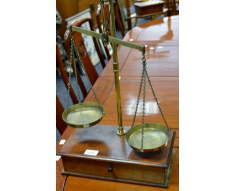 A set of 19th Century balance scales, receipt for Marchant Brook and Co, Bakewell, weights