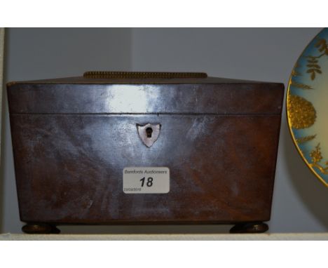A 19th century mahogany sarcophagus shaped tea caddy, two compartments, bun feet, c.1820