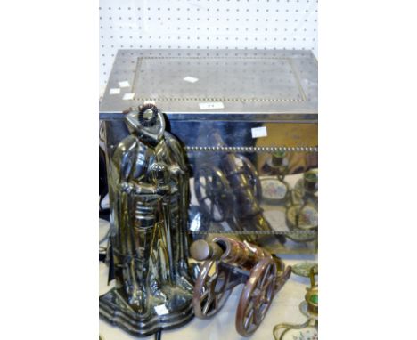 A 20th century chrome log box; a novelty hearth stand in the form of a knight; a cannon poker stand; a mid 20th century oak b